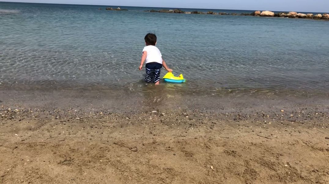 ⁣Kid playing on the beach video for sale