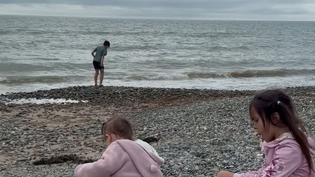 ⁣Child playing on the beach video for sale